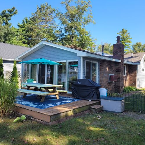 Exterior:  the back of the cottage, which faces the lake.