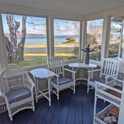 Enclosed front porch:  the home has lovely enclosed front porch with a great view of crystal lake.