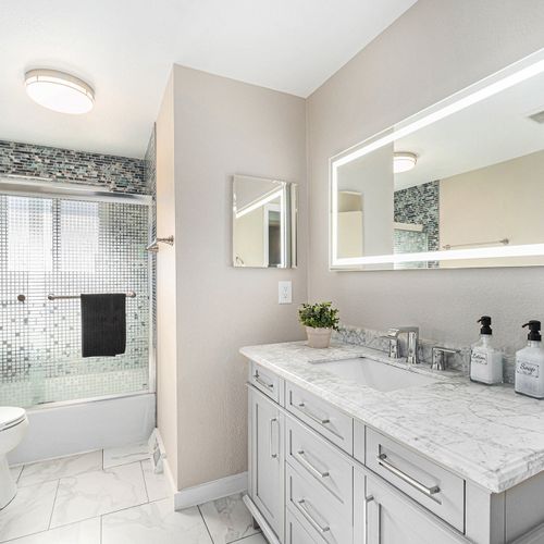 This upstairs bathroom has been fully upgraded and features a shower/bathtub combo and extended vanity.