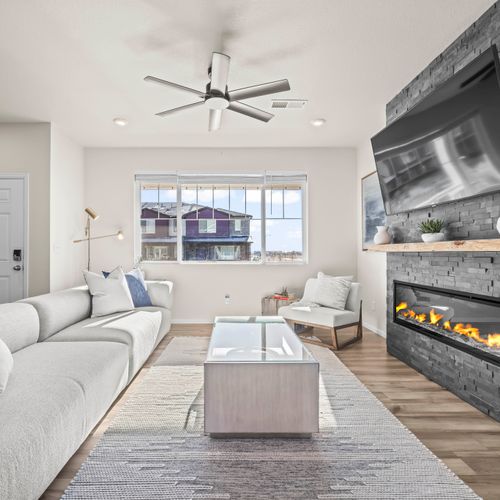 Bright, cozy living room with fireplace and tv —perfect for relaxing after a day out.