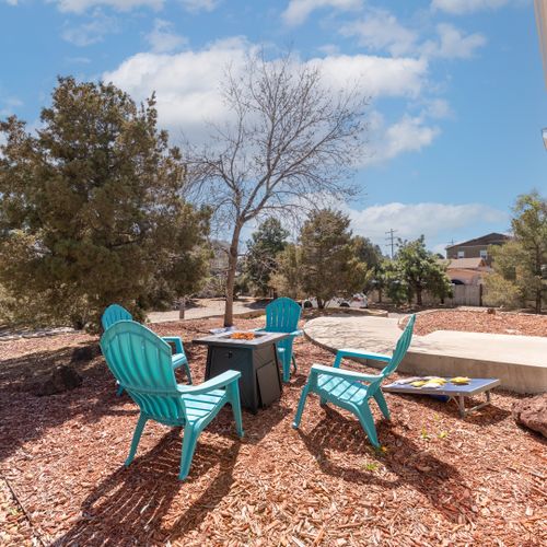 Gather by the firepit and enjoy outdoor games in a cozy, inviting setting.