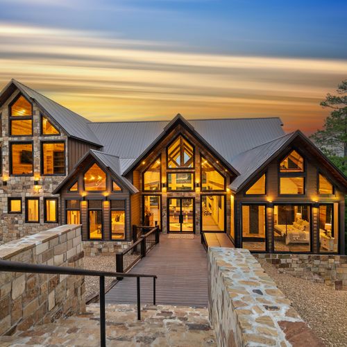 Welcome to Glass and Timber, your luxurious woodland sanctuary tucked deep within the towering, mature trees of Broken Bow.