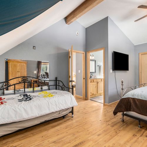 - versatile bedroom features a king bed and full bed with bright natural lighting