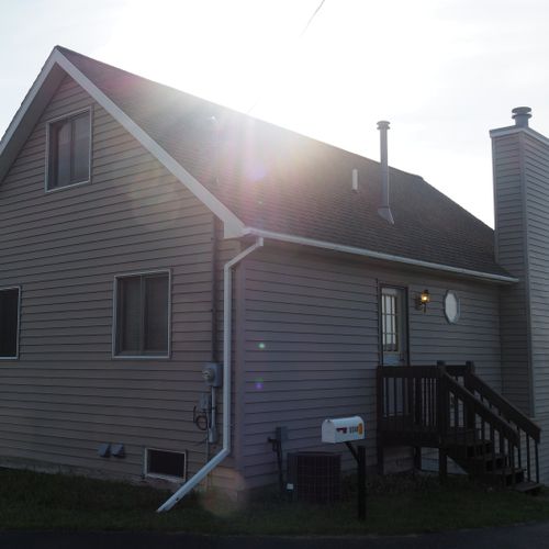 Exterior:  the front of the house with the sun in the background.