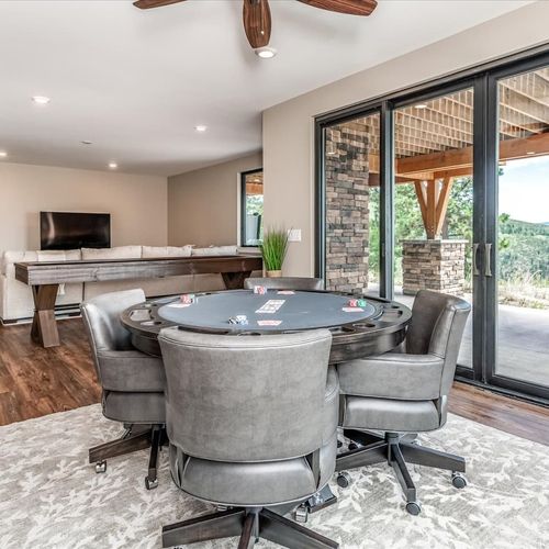 - challenge your group to poker night around this padded card table for four
- with a flat screen tv, shuffleboard table, and patio access, the fun never ends
- designed for connection, laughter, and laid back group entertainment