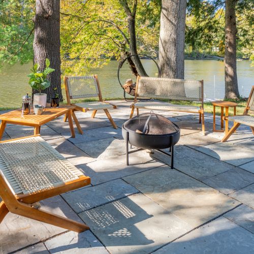 Fire pit and patio furniture along the river.
