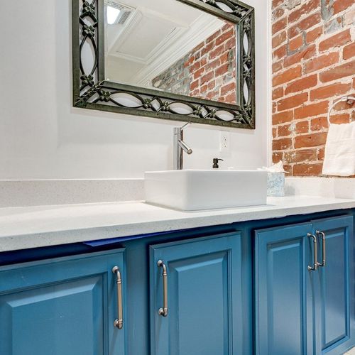 Bathroom vanity w/ sink & plenty of counter space.