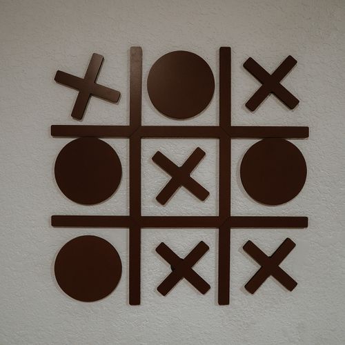 Tic tac toe, anyone? Our wall-mounted game is ready for some friendly competition. Gather around and let the games begin!