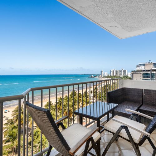 Wake up to paradise! Your private balcony offers breathtaking panoramic views of the sparkling turquoise ocean and golden sands, perfect for your morning coffee or evening cocktails.