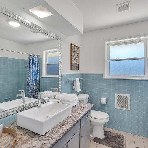 Freshen up in this clean and airy bathroom, complete with modern fixtures and a touch of vintage charm. Everything you need for a comfortable stay!