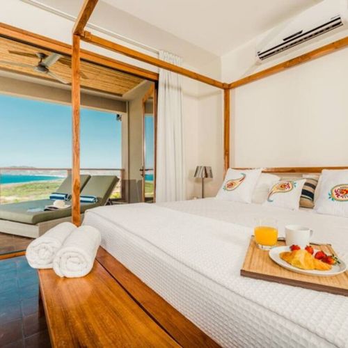 Bedroom that leads to ocean view patio