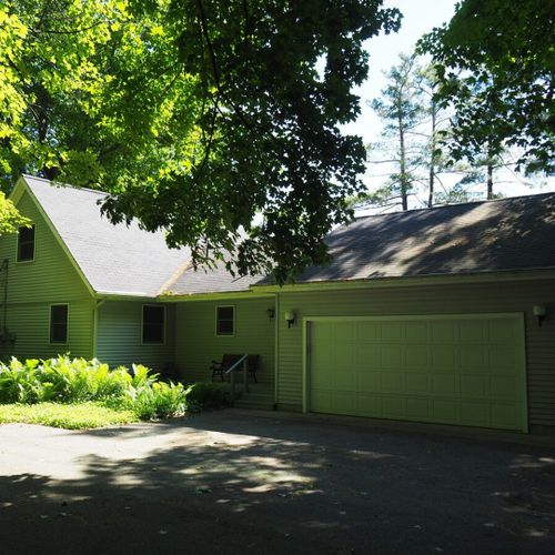 Exterior:  the front of the cottage, showing the garage that has plenty of room for 1 car (which is extremely convenient in the winter).