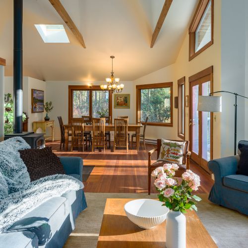 The common areas are connected with large windows and elevated ceiling for a spacious feel inside.