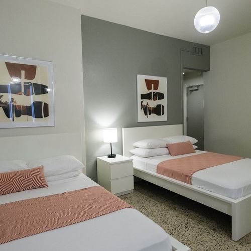 Discover true comfort in our thoughtfully designed bedroom, featuring a pristine bed and tasteful decor, ready for your well-deserved rest after a day of adventures.