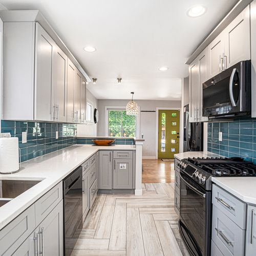 Modern kitchen with stainless steel appliances, ready for your culinary creations.