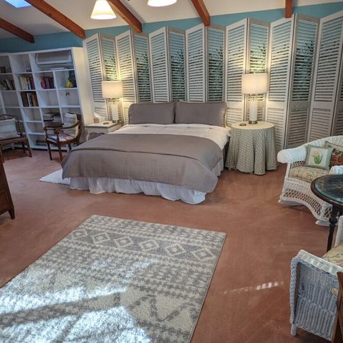 Bedroom #1 (first floor):  this bedroom has a long private entryway that opens up into an incredibly large bedroom with its own king size bed, television, library, sitting area, and private en suite bathroom.