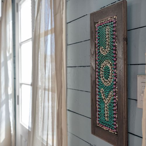 Carved wooden door panel adding a rich, artistic touch to the space.