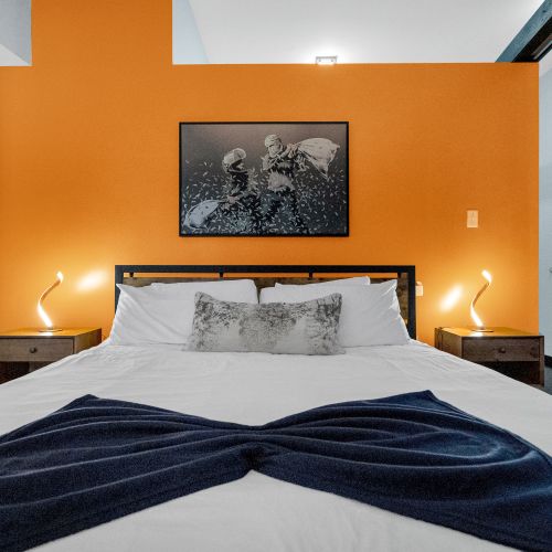 Experience comfort and creativity in this spacious bedroom, where modern design meets comfort. Drift off in style after a day of New Orleans adventures.