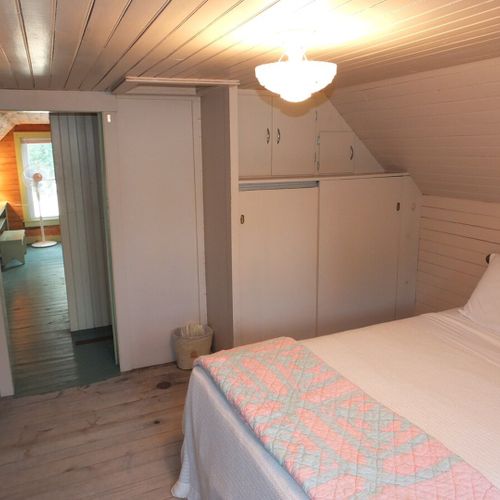 Bedroom #3 (second floor):  features a full-size bed, baby crib, dresser, mirror, and closet.