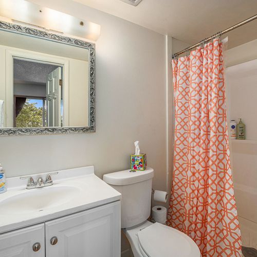 Refresh in the ensuite walk-in shower—minimalist, clean, and effortlessly calming.