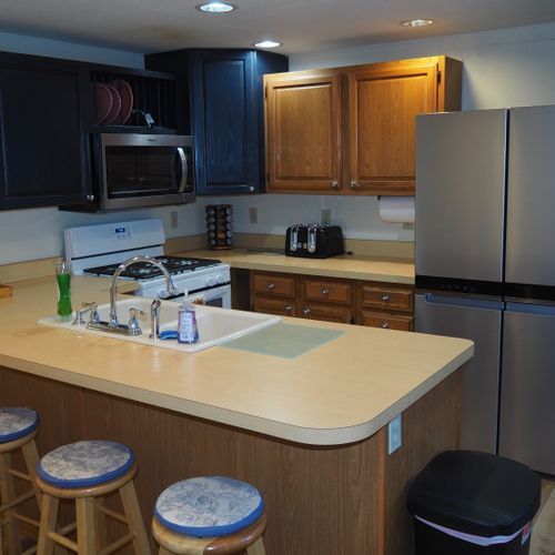 Kitchen:  newly remodeled kitchen with stainless steel appliances, including a dishwasher and microwave.