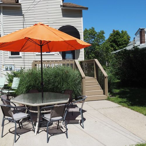 Exterior:  another view of the backyard and outdoor dining furniture