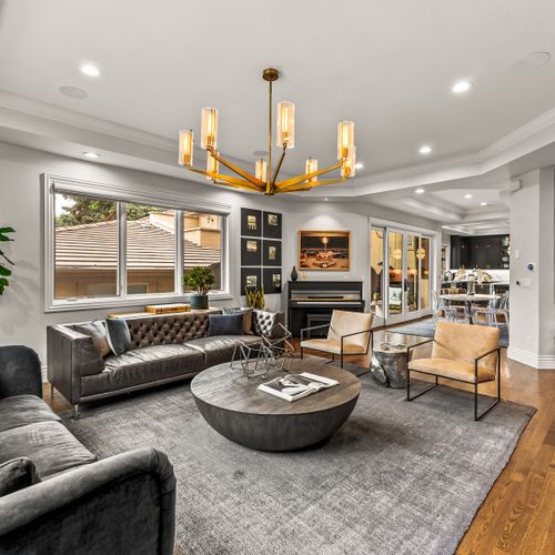 Thoughtfully styled with deep cushions, soft lighting, and luxe textures, this living room invites you to stay a while.