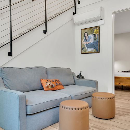 This smartly designed space connects the living room to the bedroom, offering both comfort and privacy for couples or small groups.