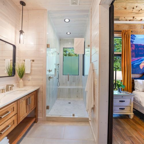 Privacy meets luxury in this beautifully crafted ensuite bathroom, where warm textures and clean finishes soothe the senses.