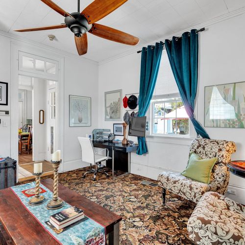 Sunlit living space w/ local flair & vibrant character.