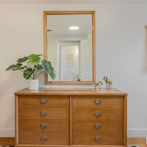 Style up in front of the large accent mirror in the twin bedroom and get ready for the day.