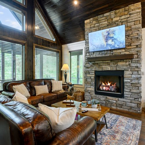 Luxury couches surrounding the stone fireplace!