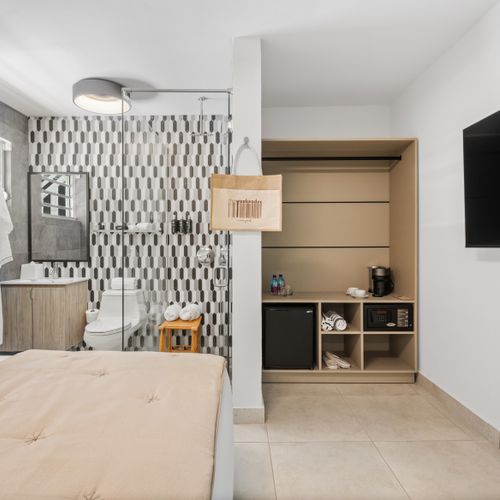 Your home away from home, complete with a dreamy bed and a big television.