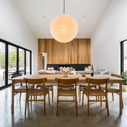 Spacious dining area perfect for gathering and sharing meals with beautiful forest views.