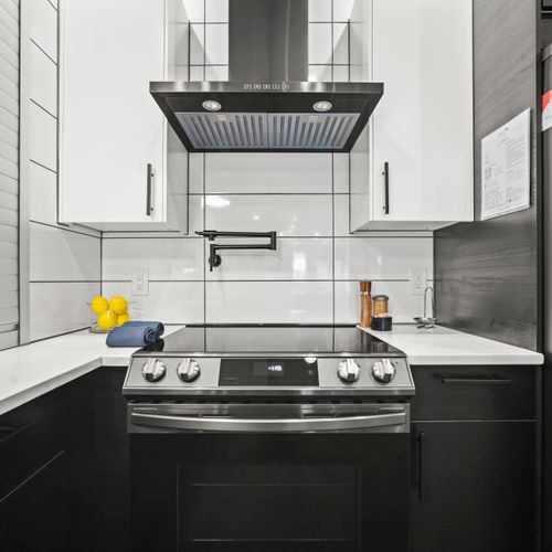 Gas range and oven with vent hood for everyday cooking.