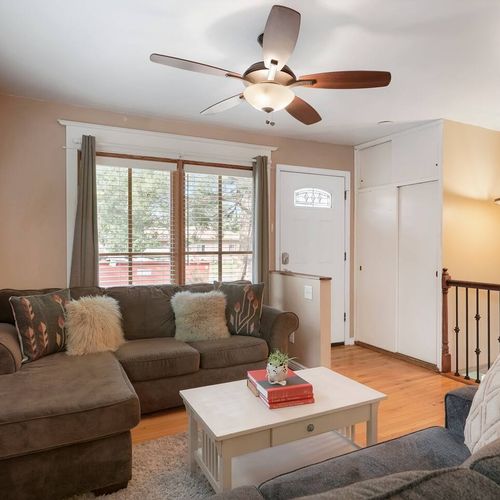 - plush seating, wood floors, and soft lighting welcome you into the home
- large front window brings in natural light for relaxing or reading
- ideal for conversation, tv nights, or simply putting your feet up and unwinding