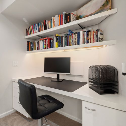 Tidy desk and thoughtful reads make it easy to settle in and get work done.