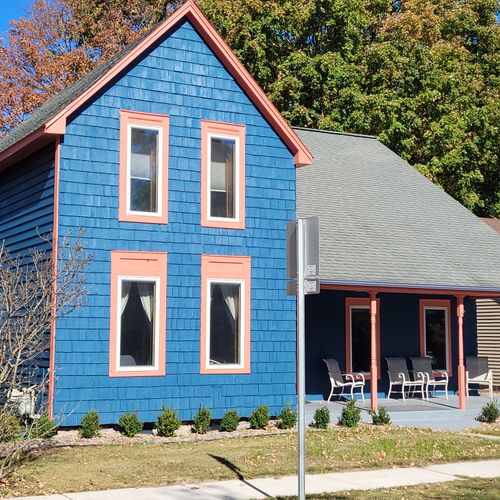 EXTERIOR:  The front of the house in early September