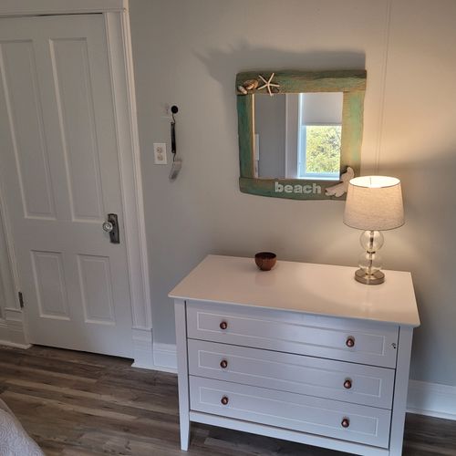 BEDROOM #4 (SECOND FLOOR):  Features 2 twin beds, window A/C unit (not shown), ceiling fan, nightstand, lamp, dresser, and a closet.