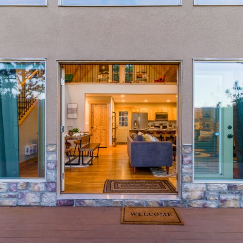 Relax in serenity on the front patio, one of two entrances to the cabin.