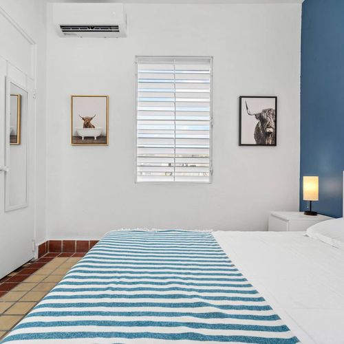 Indulge in the cozy ambiance of our stylish bedroom; every detail is designed for your ultimate comfort and relaxation.