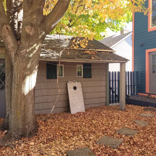 EXTERIOR:  The large and family-friendly backyard with back porch, propane grill, outdoor dining, lawn games, and a "smokeless" bonfire ring.