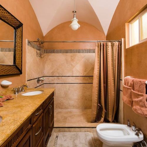 The master bathroom has a large shower.