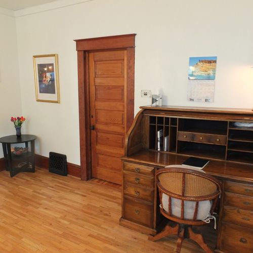 Dining area:  in the large dining area between the kitchen and the living room, there is also a nice wooden desk. Note that the door shown is the bedroom door for the master bedroom. (the master bedroom is on the first floor. )