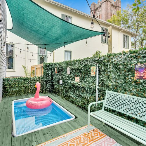 Enjoy a peaceful retreat in our private pool area, complete with a shaded seating space and playful pool float—perfect for soaking up the New Orleans sun!