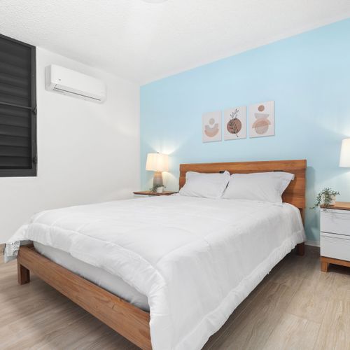 A stylish and warm bedroom, your perfect city retreat.