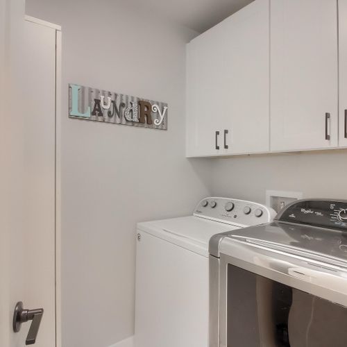 - take care of laundry with ease using the full washer and dryer tucked in a private space
- overhead cabinets provide plenty of room for storage and supplies