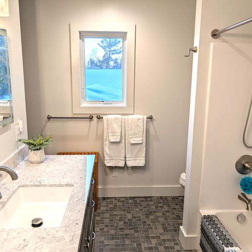 BATHROOM #2 (UPPER LEVEL):  Full bathroom on the top floor (third floor) with a combination tub and shower.  Includes private entrance from the top floor bathroom as well as a washer and dryer in a laundry closet.