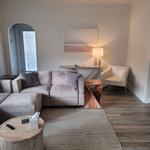 LIVING ROOM:  Gorgeous living room that features a gas fireplace and a large television with live streaming via Hulu, Netflix, and Disney+.