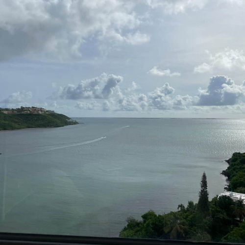 Postcard Perfect: Capture stunning moments with this beautiful view of the open water and elegant sailboats.